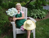 Lady holding a flower.